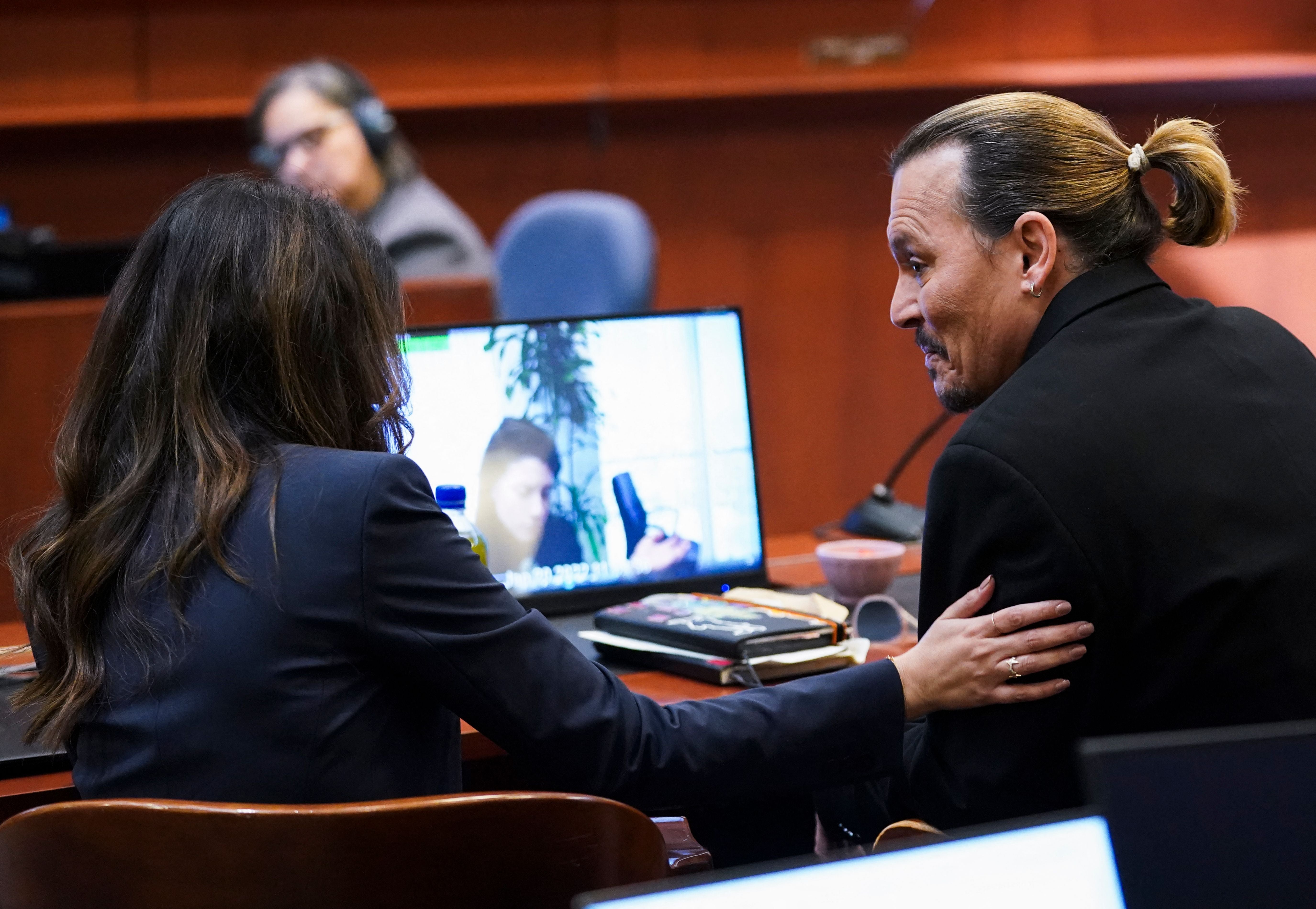 Johnny Depp and Camille Vasquez at the Fairfax County Courthouse in Fairfax, Virginia, on 18 May 2022