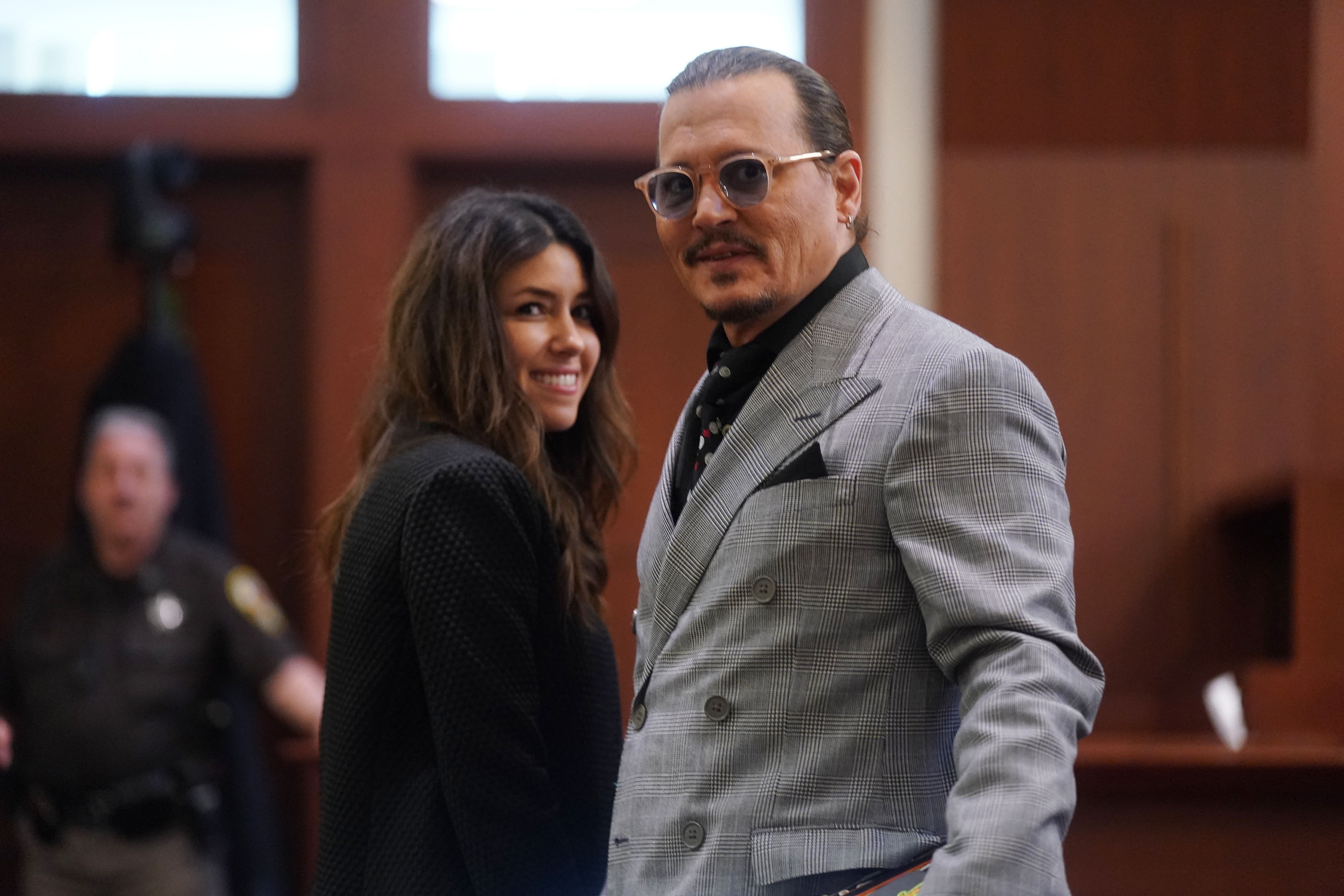Johnny Depp and Camille Vasquez at the Fairfax County Courthouse in Fairfax, Virginia, on 19 May 2022