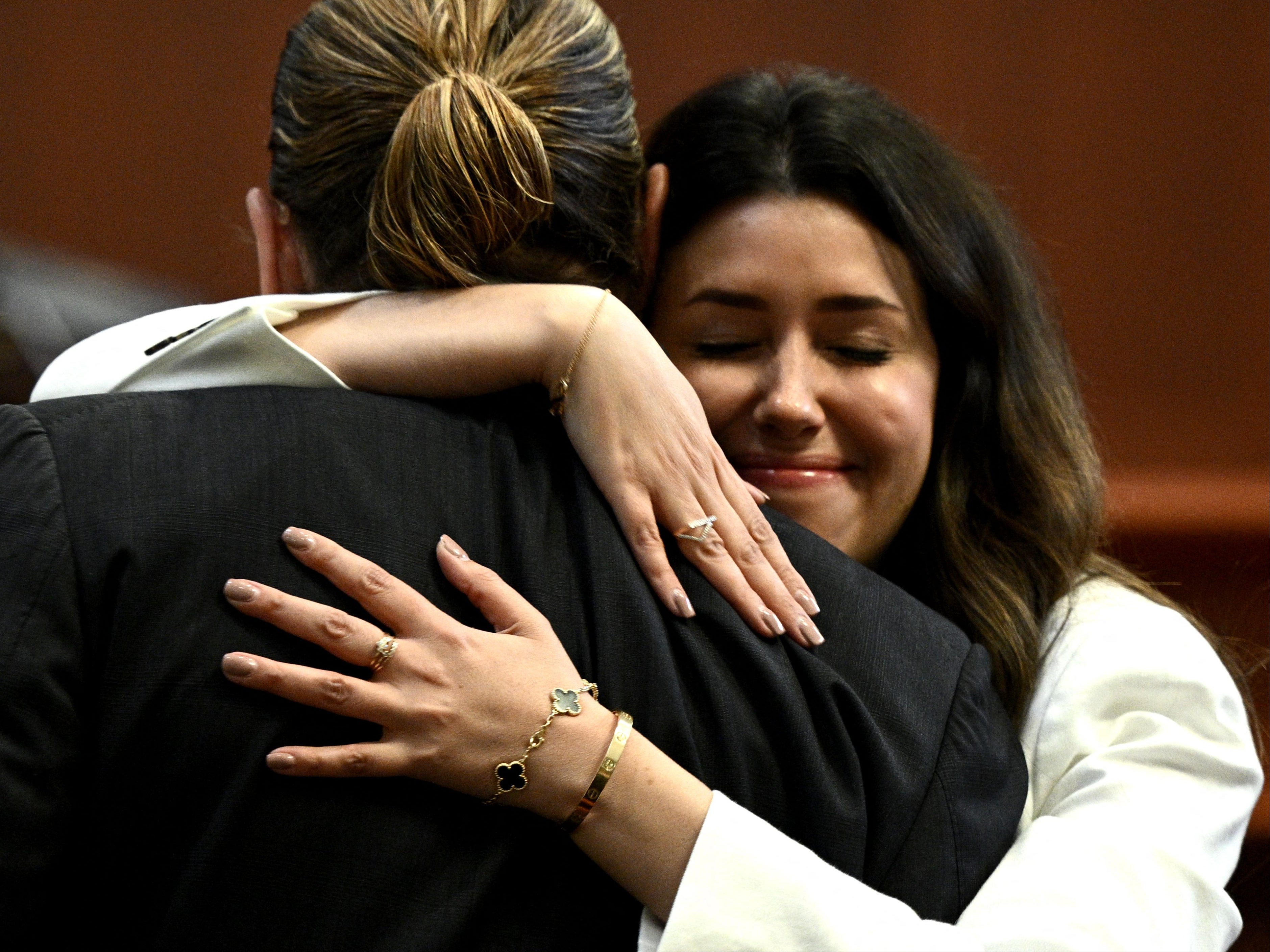 Attorney Camille Vasquez embraces actor Johnny Depp in a courtroom at the Fairfax County Courthouse in Fairfax, Virginia, on 17 May 2022