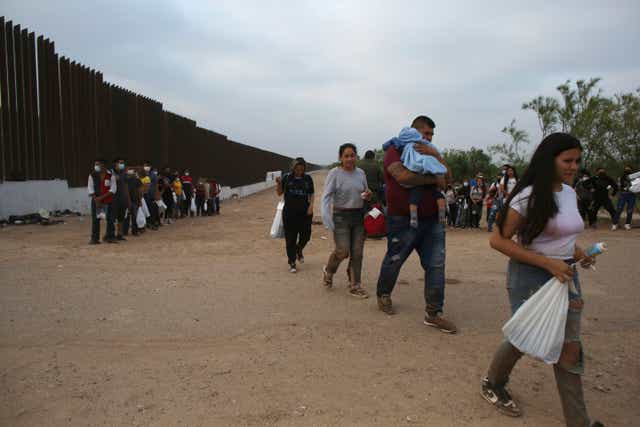 <p>Migrants who had crossed the Rio Grande river into the United States are taken away by U.S. Border Patrol agents in Eagle Pass, Texas, Friday, May 20, 2022</p>
