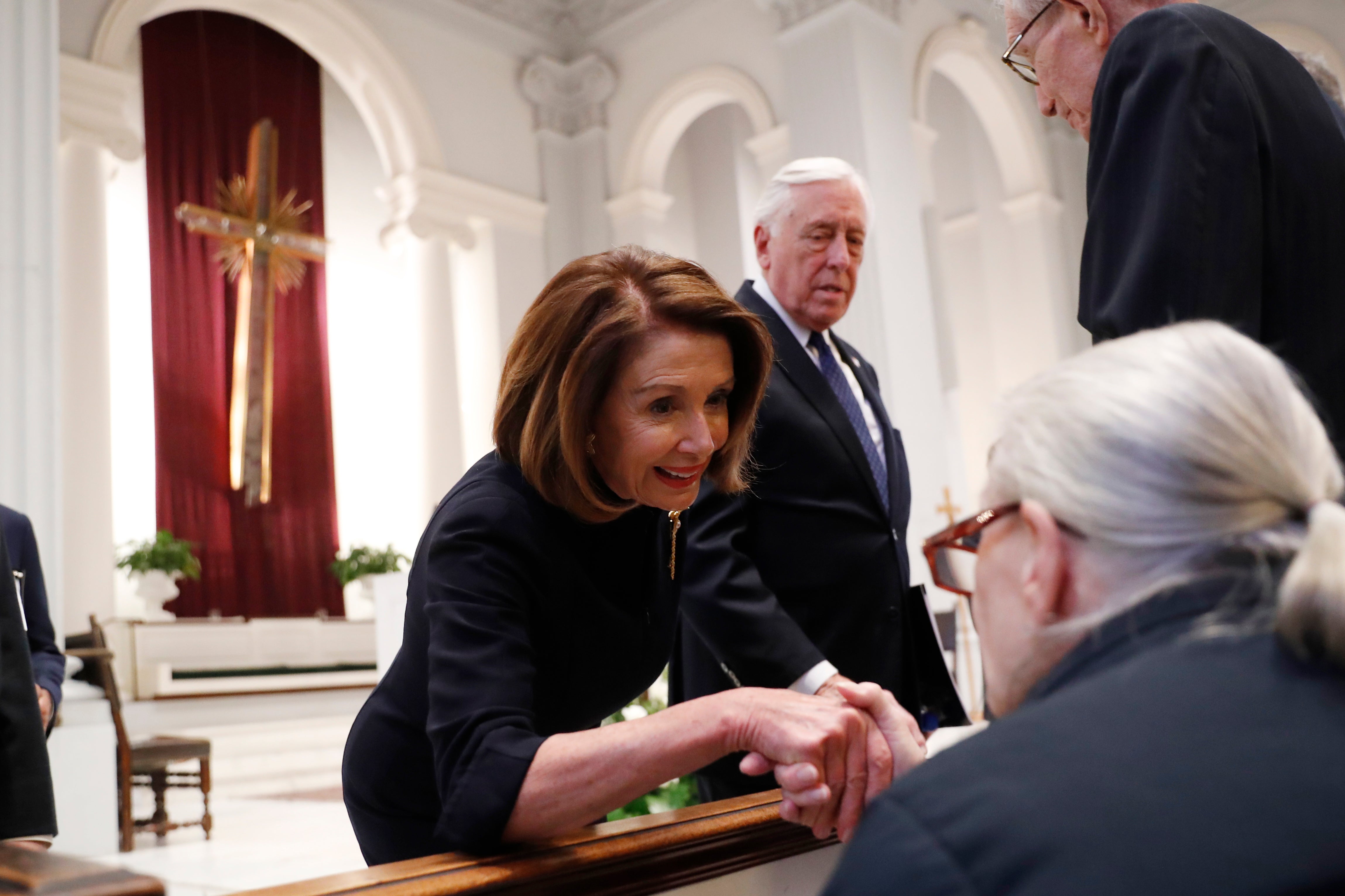 House Speaker Nancy Pelosi and Rep. Steny Hoyer (D-MD) greet family members before a funeral service for former Rep. John Dingell on February 14, 2019 at Holy Trinity Catholic Church in Washington, DC.