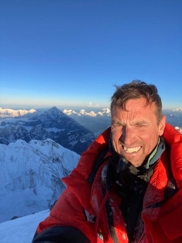 <p>Kenton Cool at the summit of Mount Everest</p>