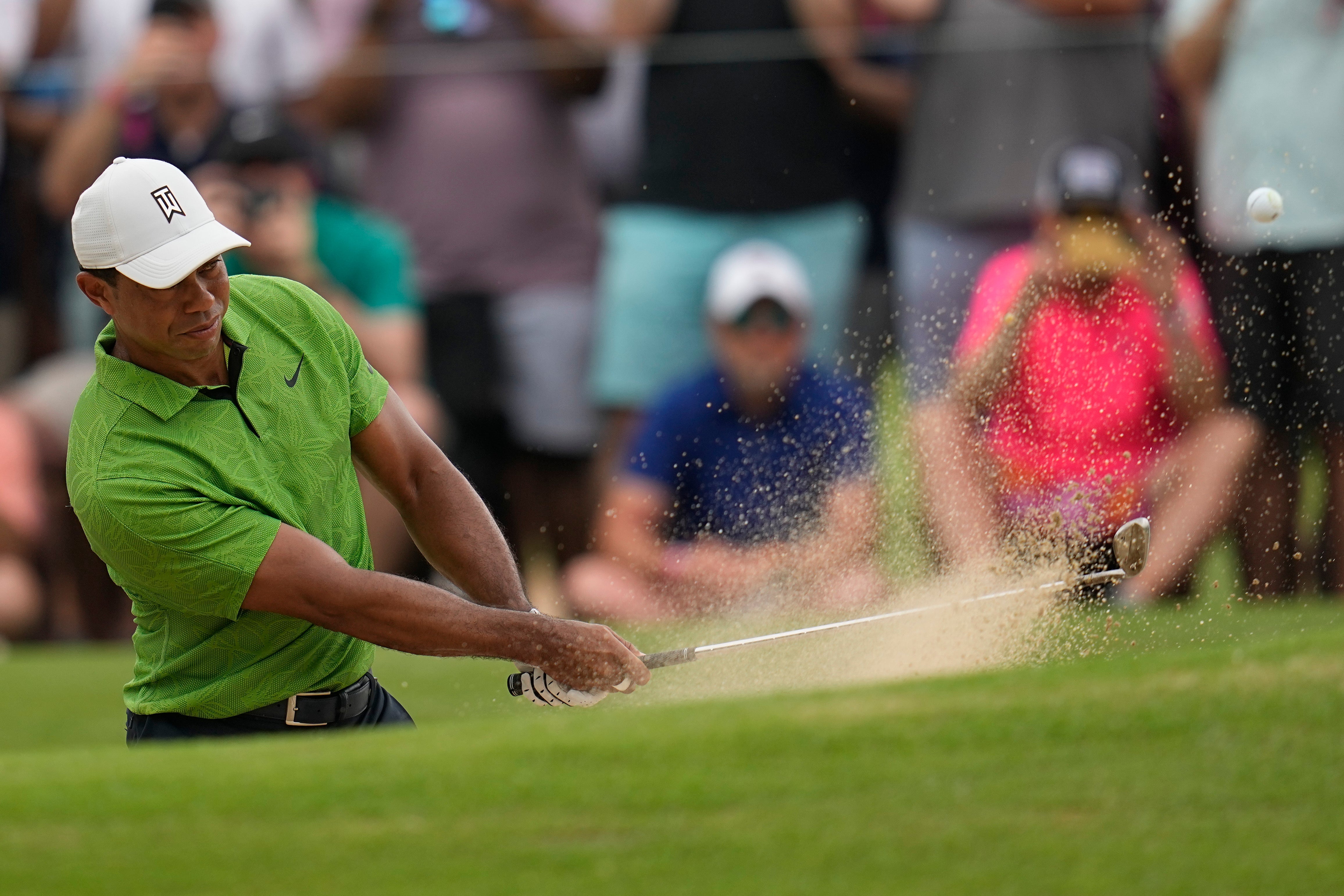Tiger Woods hits from the bunker on the second hole during the second round of the US PGA Championship (Sue Ogrocki/AP)
