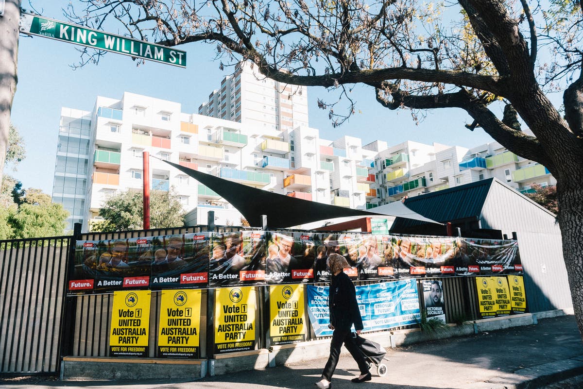 Australians head to vote in close-run election as Scott Morrison hopes for a second term