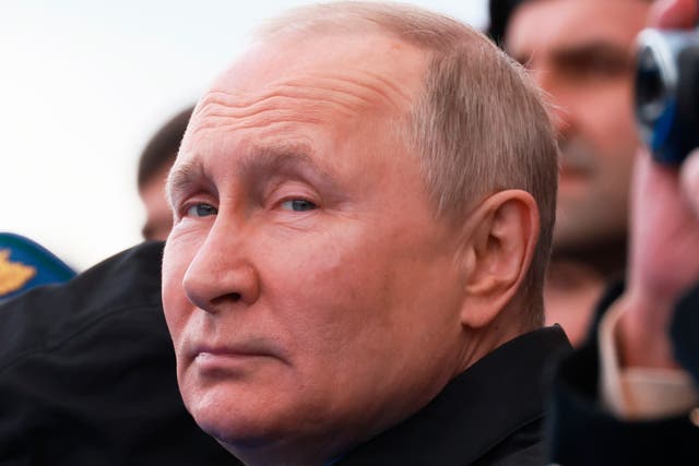 <p>Vladimir Putin looks on during the Victory Day military parade marking the 77th anniversary of the end of World War II in Moscow in May </p>