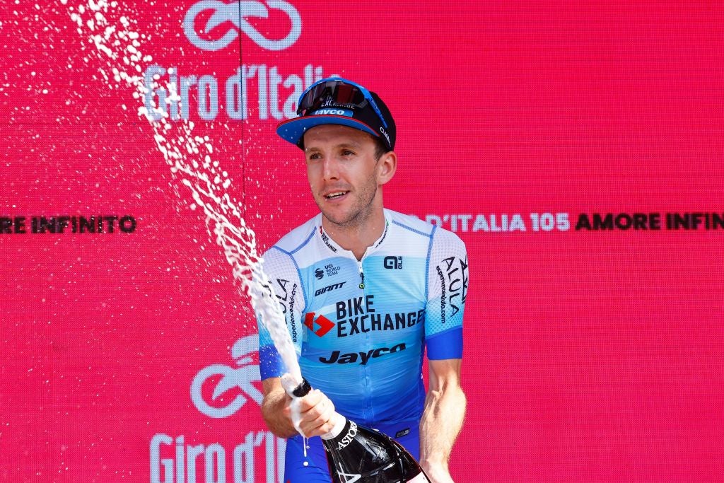 Team BikeExchange Jayco Mitchelton's Simon Yates celebrates on the podium after winning the 14th stage of the Giro 'Italia on Saturday