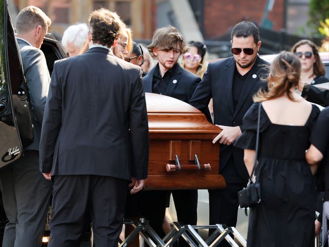 <p>The casket of Roberta Drury being brought into a church </p>