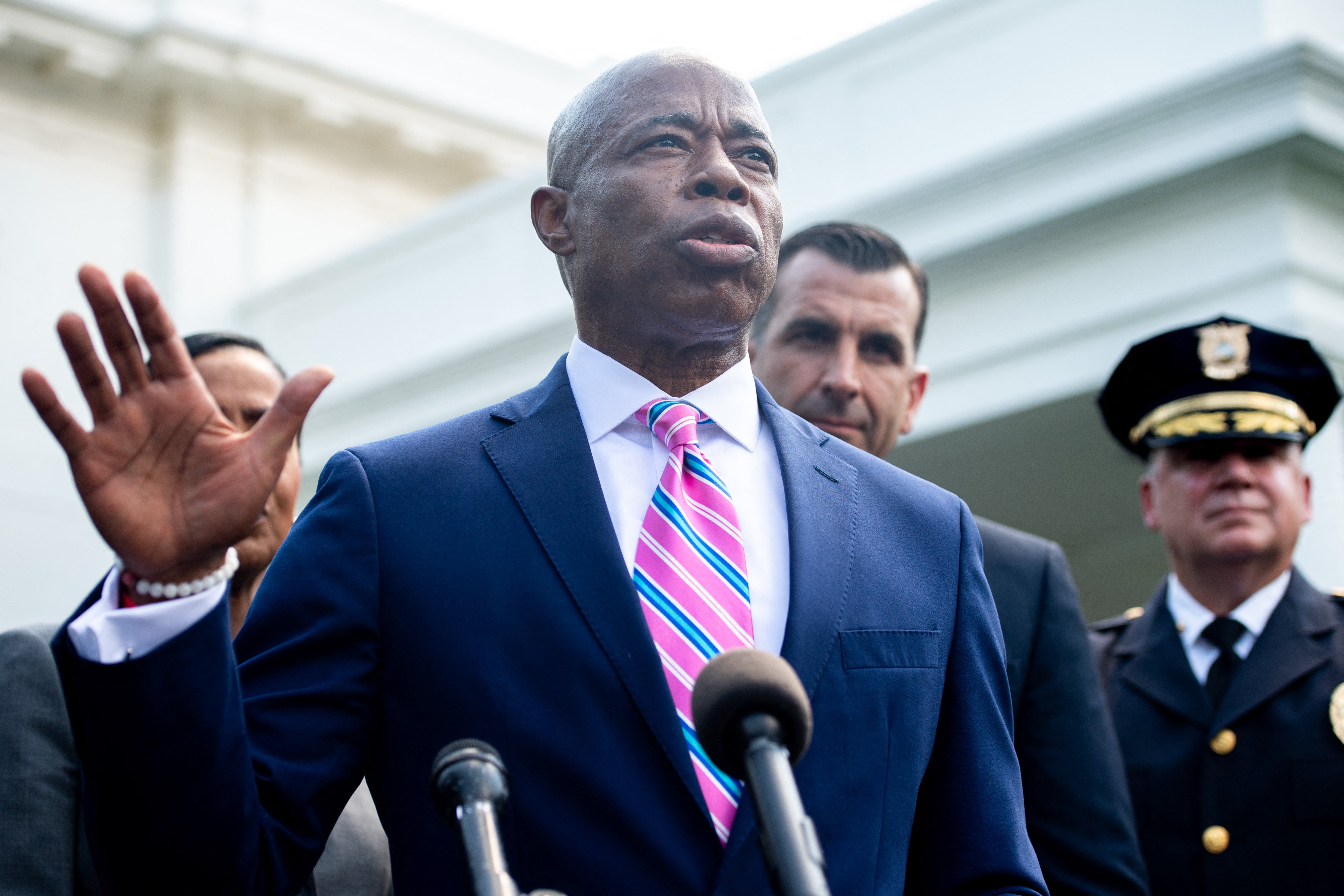Brooklyn Borough President and New York City mayoral candidate Eric Adams (C) speaks to the media alongside other local and law enforcement officials outside the West Wing of the White House in Washington, DC, July 12, 2021