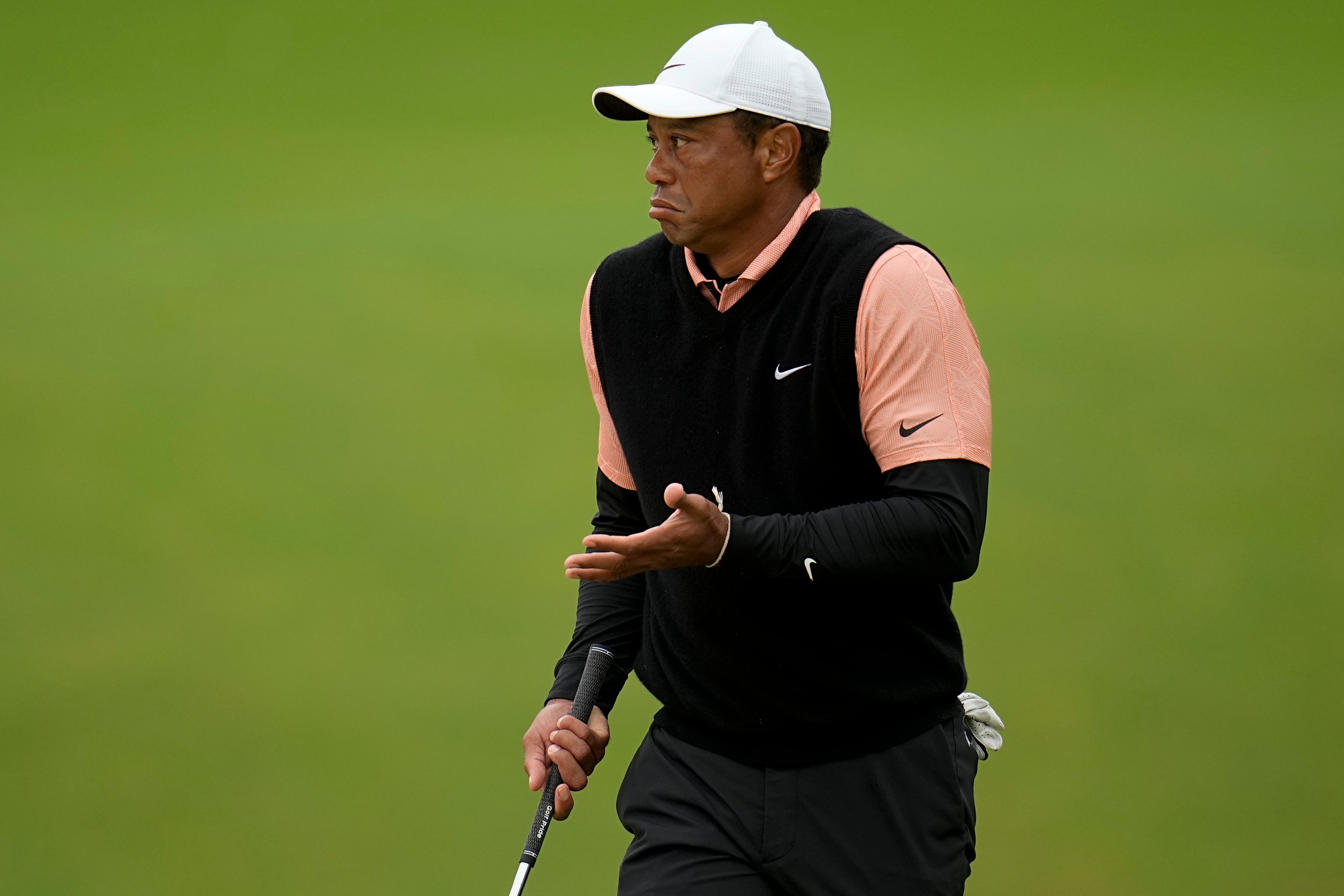 Tiger Woods gestures on the 17th green during the third round of the US PGA Championship (Sue Ogrocki/AP)