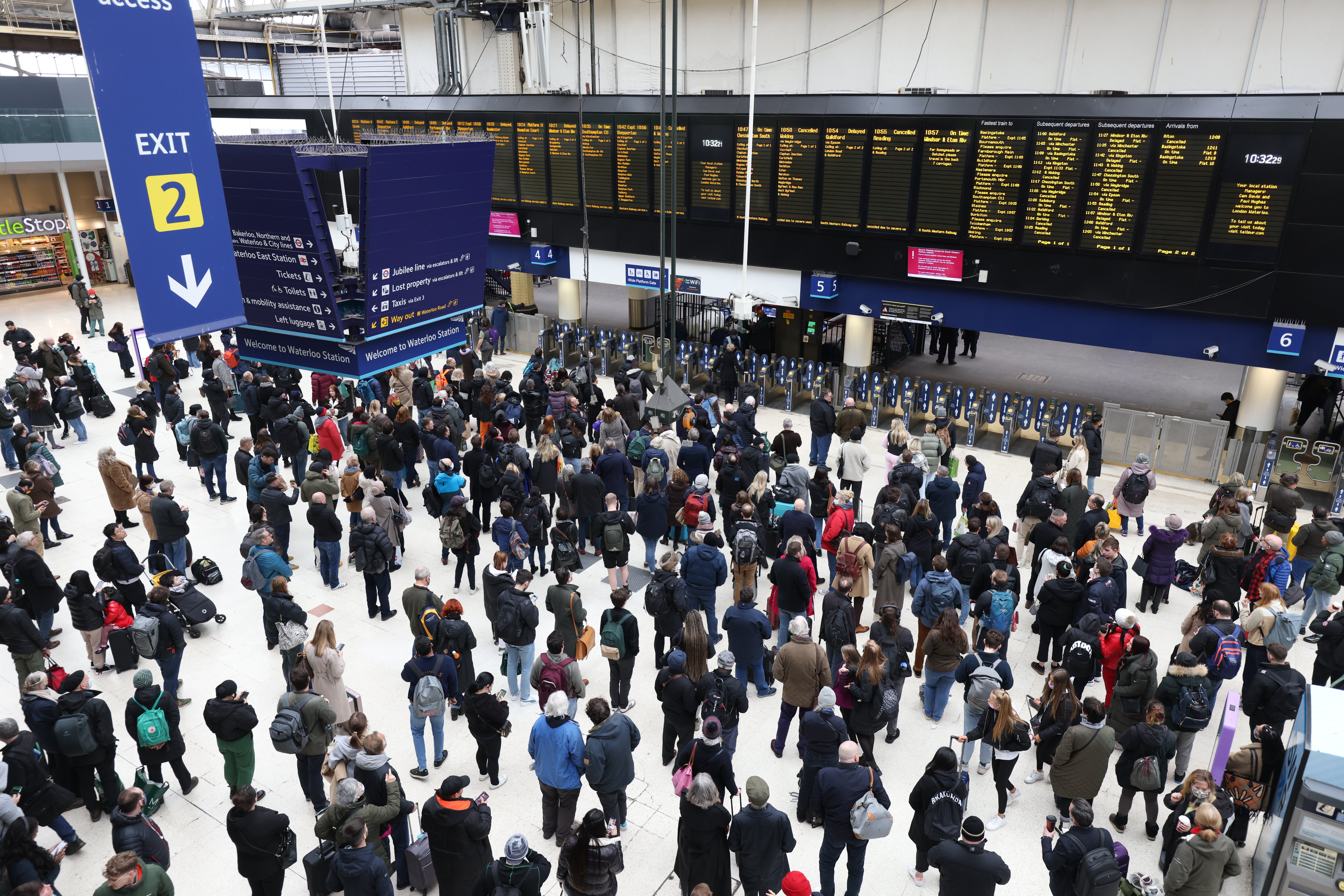 Passengers wait at Waterloo station, London, for cancelled or delayed trains. File Photo (PA)