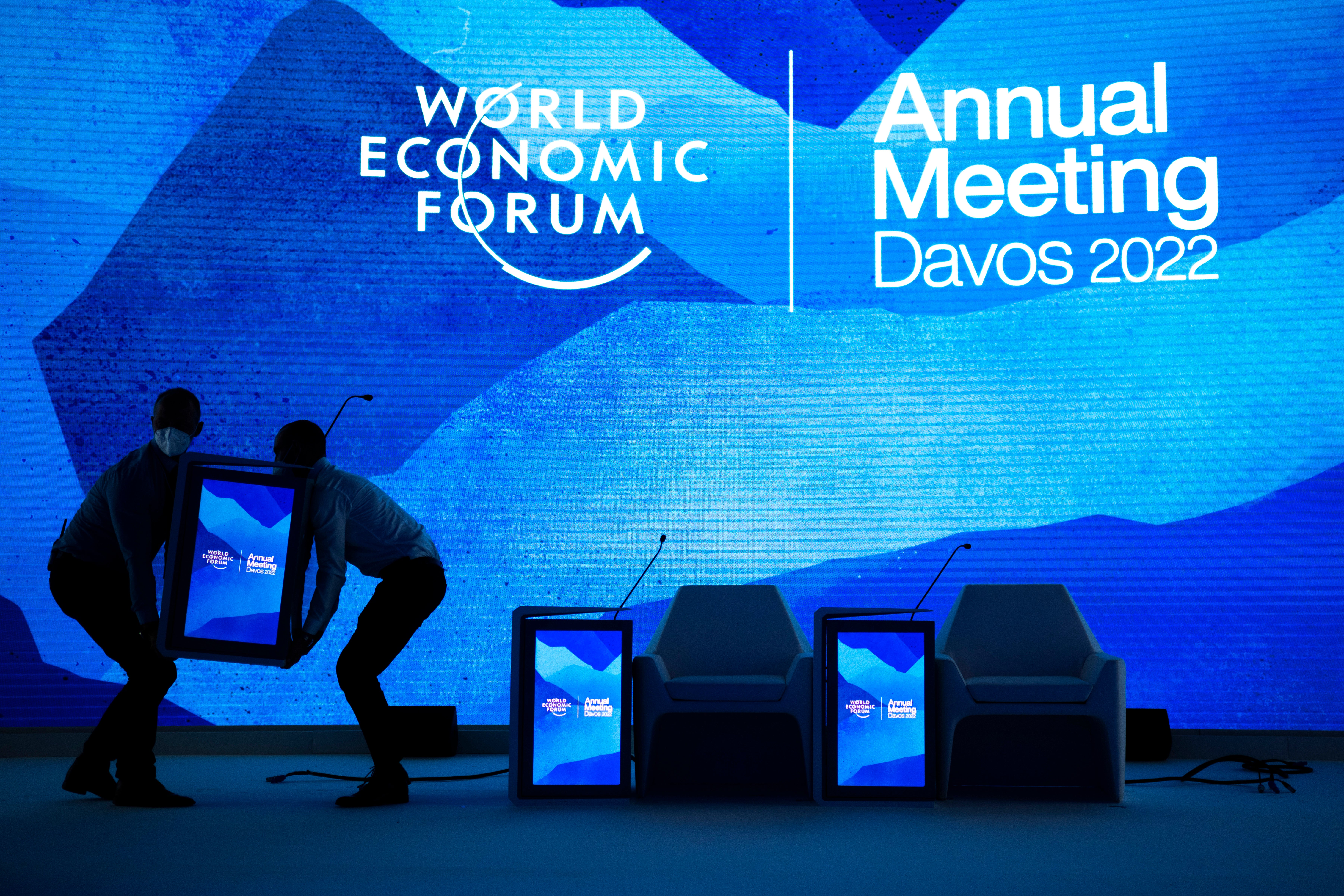 Workers set the stage prior to the annual meeting of the World Economic Forum, in Davos, Switzerland, Sunday, May 22, 2022