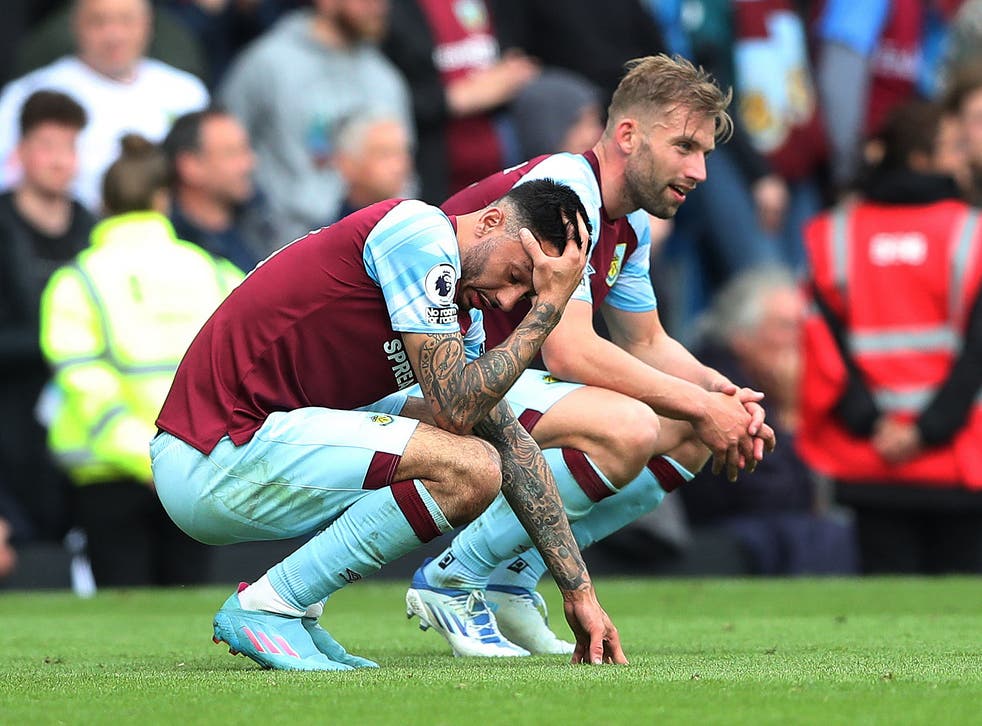 <p>Burnley players react to their relegation from the top flight</p>