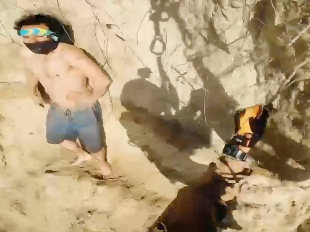 Heart-stopping moment man trapped on 500-foot cliff is rescued by helicopter