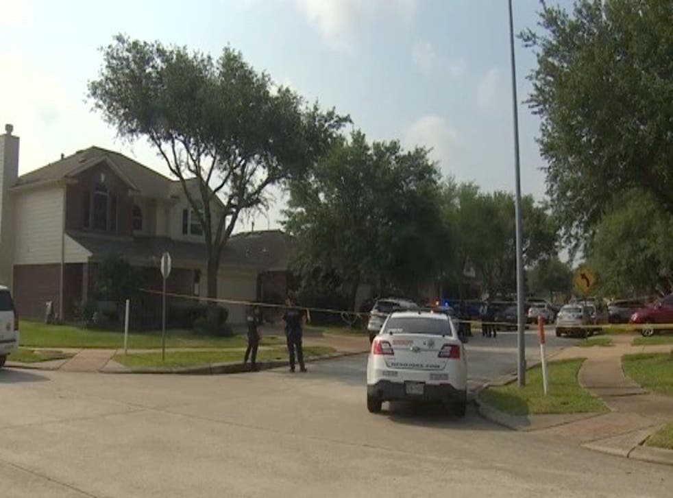 <p>Police tape around the home in Harris County where Benjamin Pierce allegedly stabbed his wife to death</p>