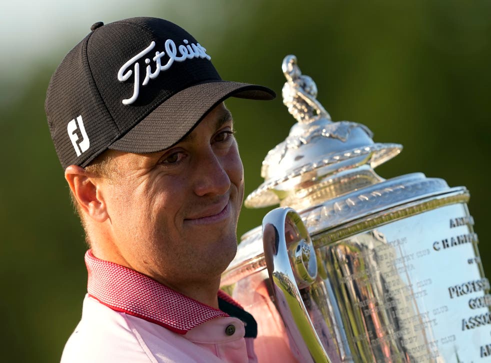Justin Thomas poses with the Wanamaker Trophy after winning the US PGA Championship for the second time (Matt York/AP)
