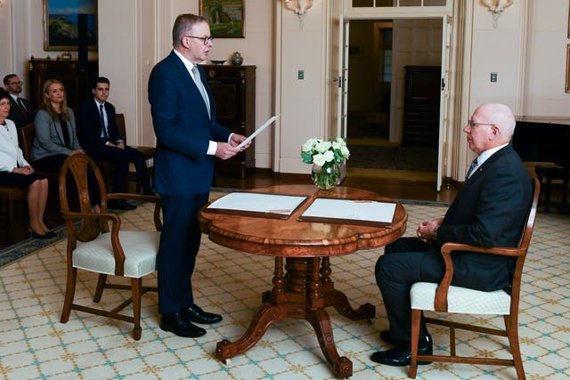 <p>Anthony Albanese is sworn in as Australia's prime minister by Australian governor-general David Hurley, right, during a ceremony at Government House in Canberra, Monday, 23 May 2022</p>