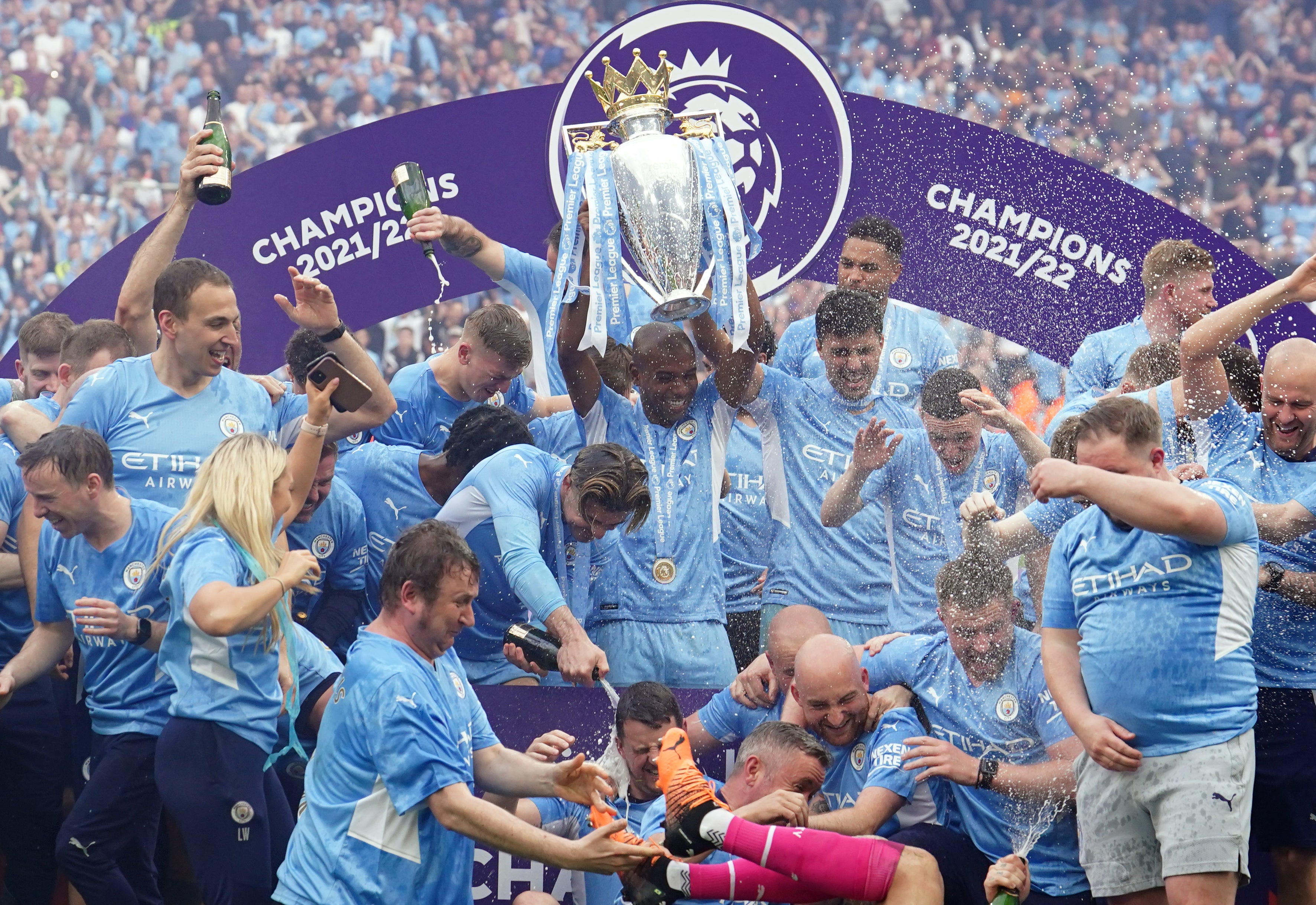 Manchester City’s Fernandinho lifts the Premier League trophy (Martin Rickett/PA)