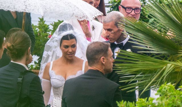 <p>Kourtney Kardashian’s wedding veil includes a giant replica of Travis Barker’s head tattoo</p>