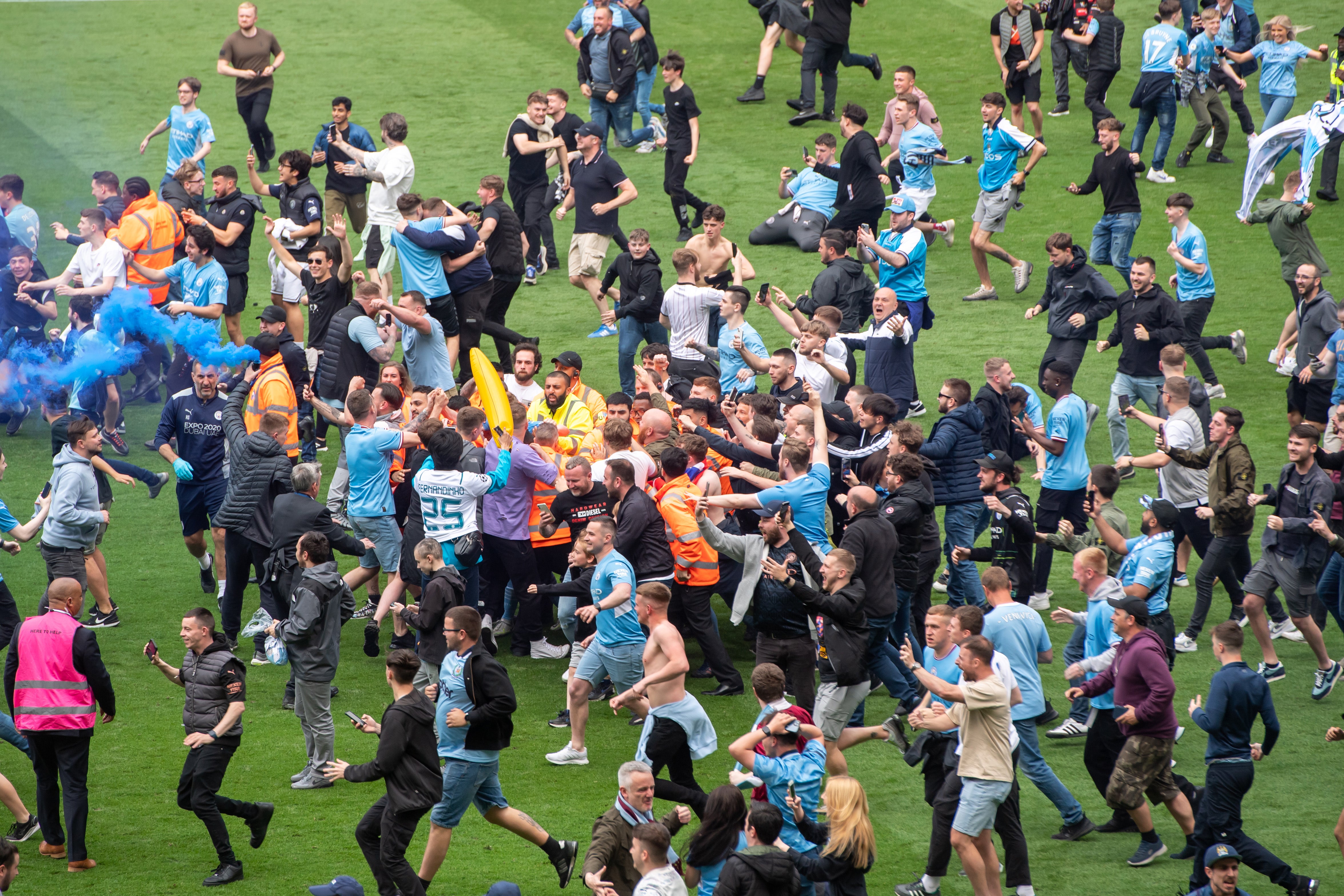 Thousands of fans rushed the pitch after City won Premier League title on Sunday