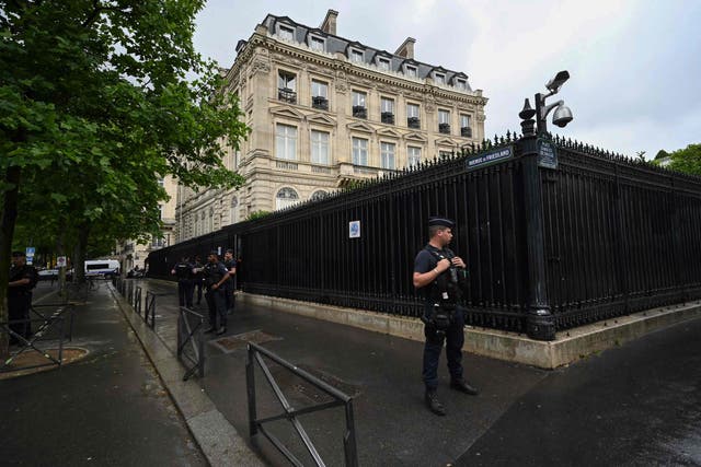 <p>French policemen take position outside the Qatar Embassy in Paris on May 23. 2022, following an incident during which a security guard died</p>