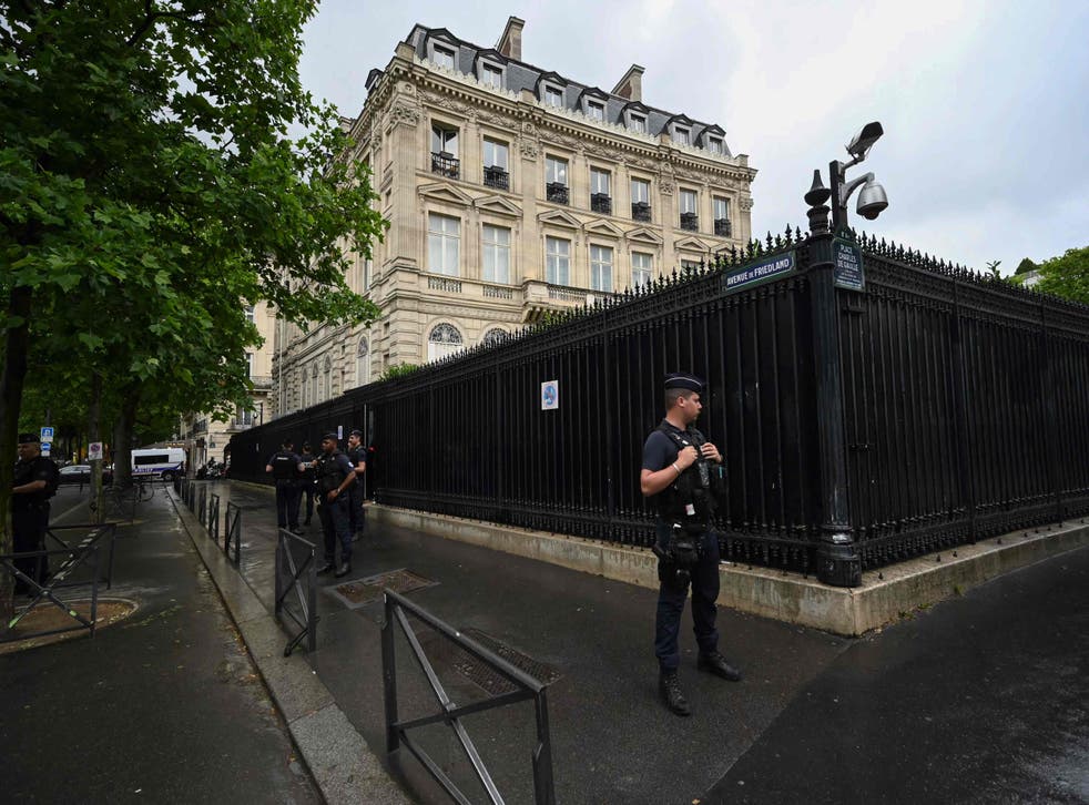 <p>French policemen take position outside the Qatar Embassy in Paris on May 23. 2022, following an incident during which a security guard died</p>