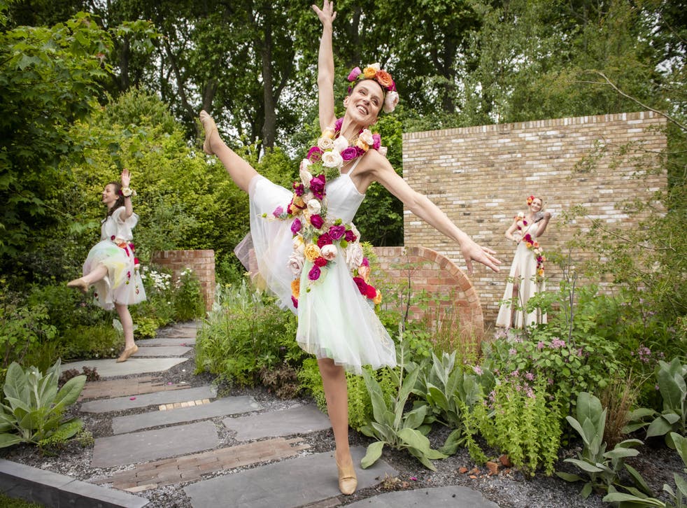 Professional dance duo Kate Garvie and her daughter Ruby Garvie, age 13, with violinist Sally Potterton, perform at the Brewin Dolphin garden designed by Paul Hervey-Brookes at RHS Chelsea Flower Show (John Nguyen/PA)