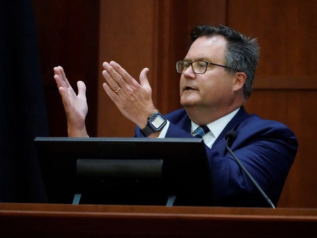 <p>Dr. Richard Moore, Jr., testifies in the courtroom during actor Johnny Depp's defamation case against ex-wife, actor Amber Heard, at the Fairfax County Circuit Courthouse in Fairfax, U.S., May 23, 2022</p>