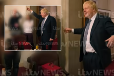 Photos appear to show Boris Johnson toasting a colleague during lockdown party