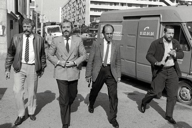 <p>In a photo taken in October 1986, Italian Judge Giovanni Falcone (2ndL), is surrounded by his bodyguards in Marseille to meet his French counterparts to investigate in the Mafia ‘Pizza Connection’ criminal plot</p>