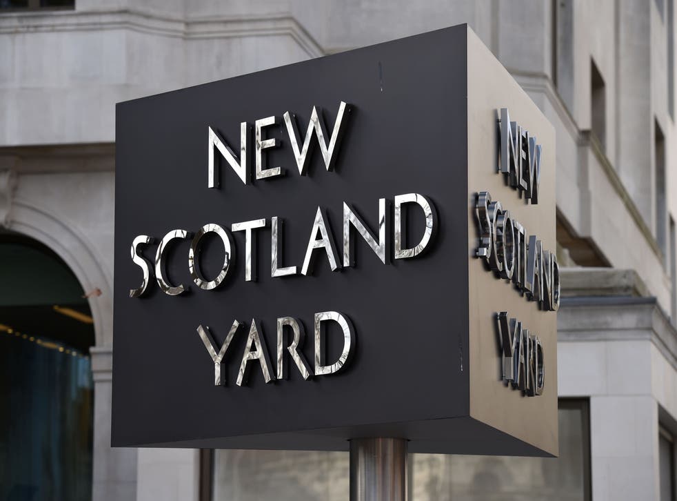 The New Scotland Yard sign outside the Metropolitan Police headquarters in London (Kirsty O’Connor/PA)