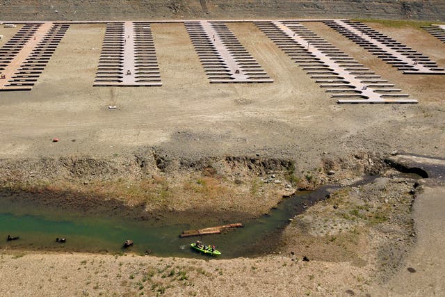 <p>Docks sit on dry land around Folsom Lake in California this month. The state is facing a devastating drought that threatens water supplies going into the dry season</p>