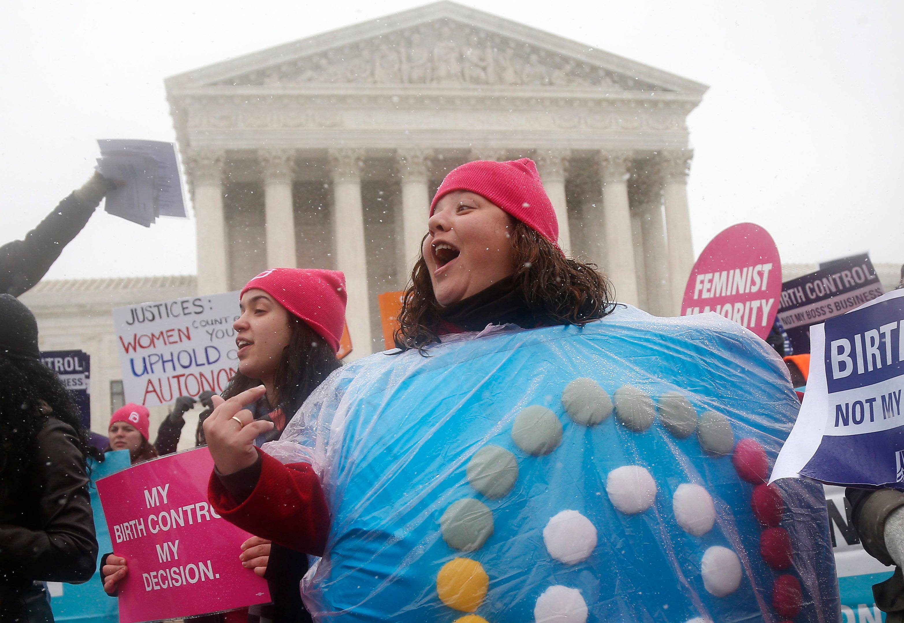 Margot Riphagen of New Orleans, wears a birth control pill costume as she protests in front of the Supreme Court in Washington