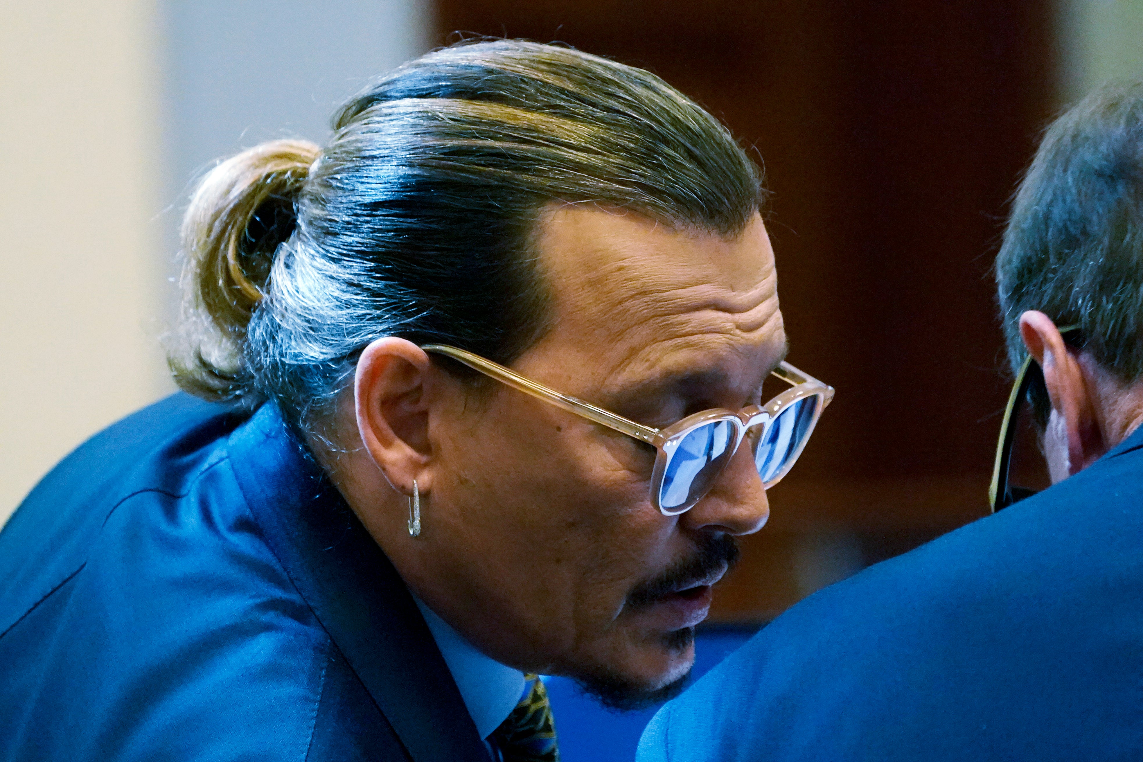 Johnny Depp in consultation with his attorney Ben Chew