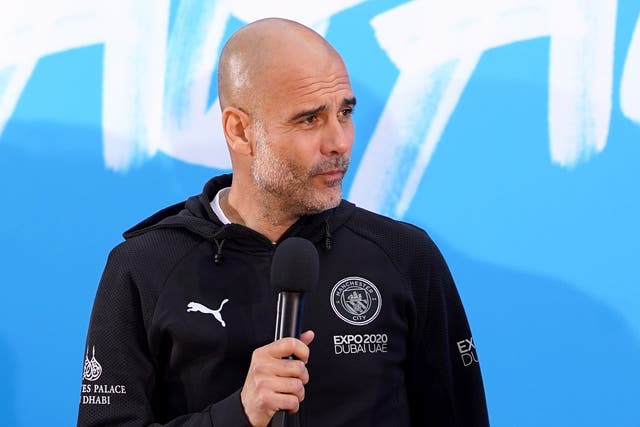 Manchester City manager Pep Guardiola on stage (Zac Goodwin/PA)