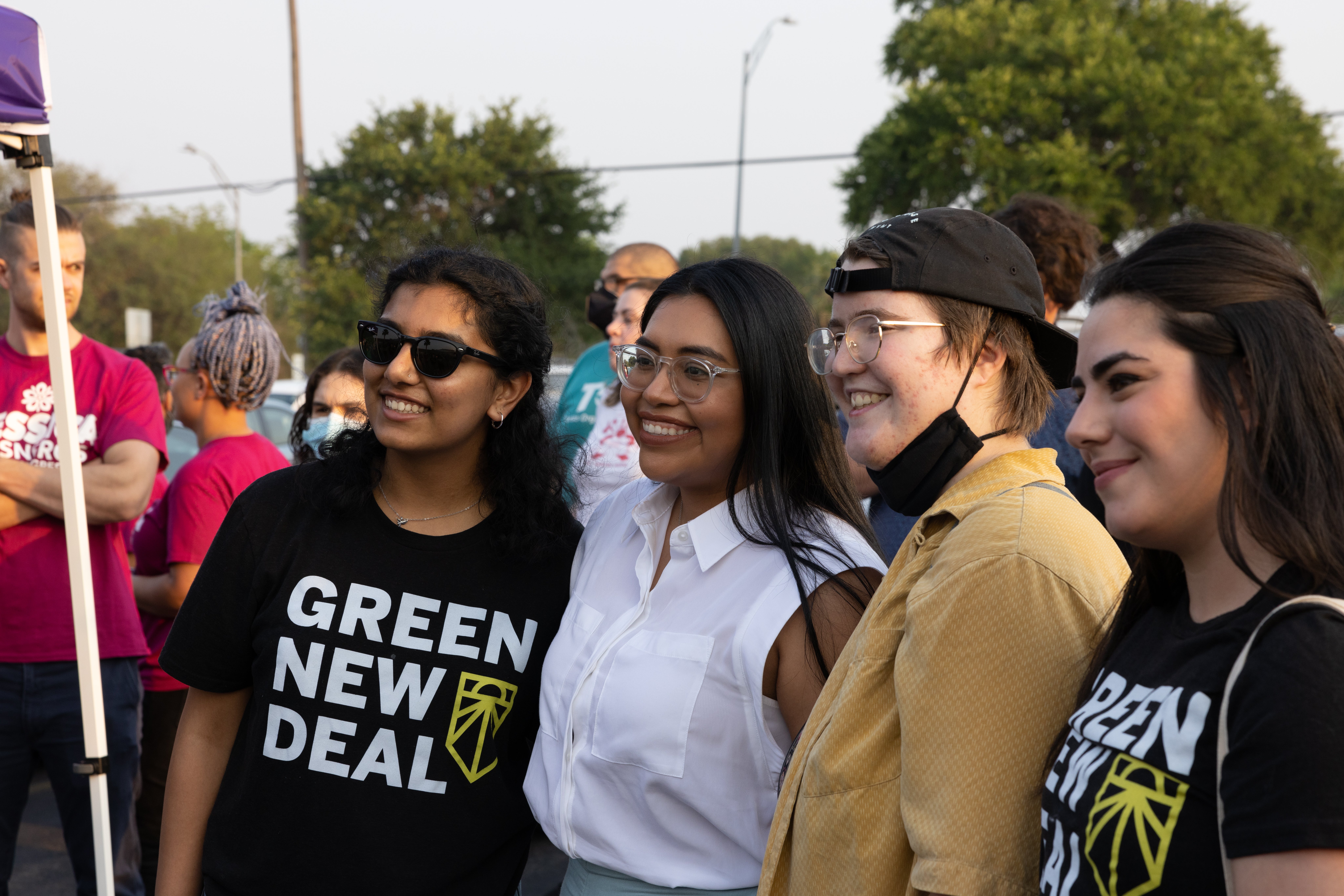 Progressive Democratic Congressional candidate Jessica Cisneros poses for photos with supporters at a nearby polling location after a campaign rally on May 20, 2022 in San Antonio, Texas.