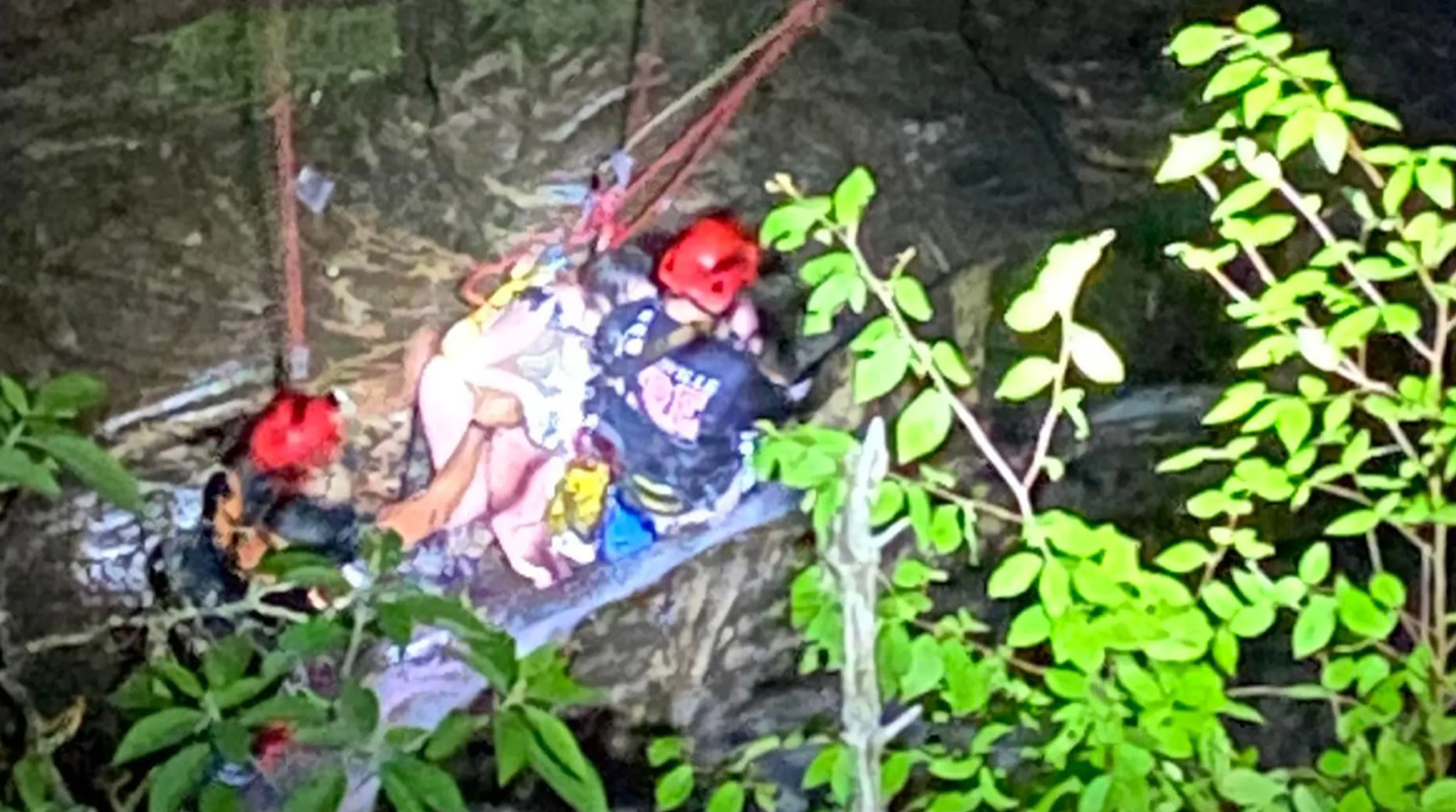 Rescuers from 18 separate agencies worked for hours to free a teenage hiker who had fallen 15m from a cliff