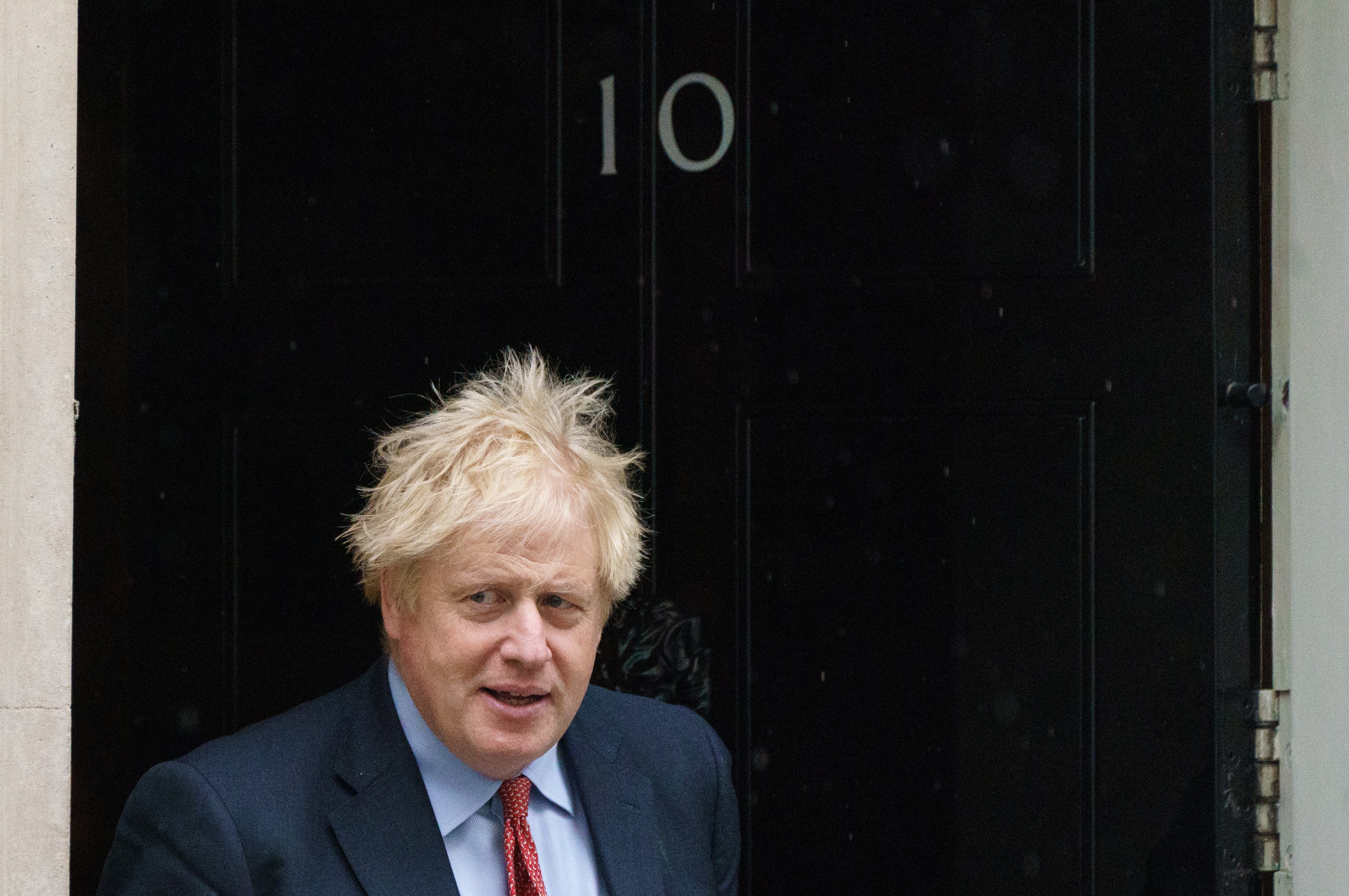 Boris Johnson is facing fresh accusations he lied to Parliament after photographs emerged of him raising a glass at a No 10 leaving party during lockdown (Dominic Lipinski/PA)