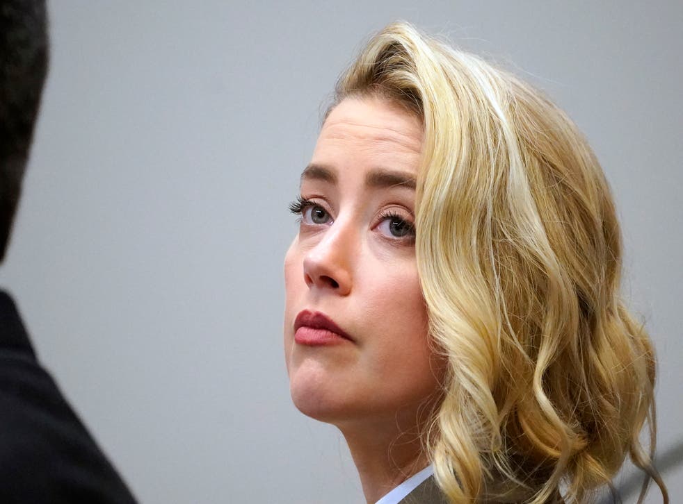 Actor Amber Heard listens in the courtroom at the Fairfax County Circuit Courthouse in Fairfax, Va., Monday, May 23, 2022. Actor Johnny Depp sued his ex-wife Amber Heard for libel in Fairfax County Circuit Court after she wrote an op-ed piece in The Washington Post in 2018 referring to herself as a “public figure representing domestic abuse.” (AP Photo/Steve Helber, Pool)