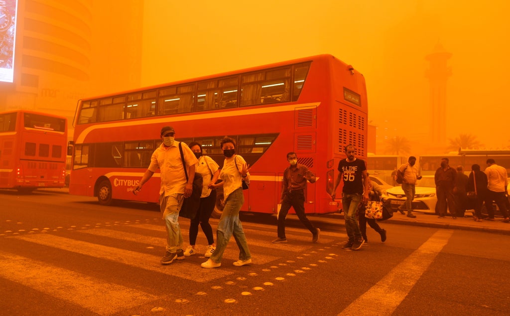 Flights disrupted and people urged to stay home as sandstorms hit Middle East