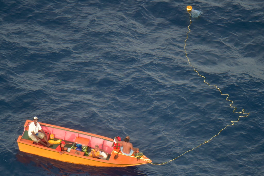 New Zealand plane finds 7 missing aboard 2 boats in Pacific