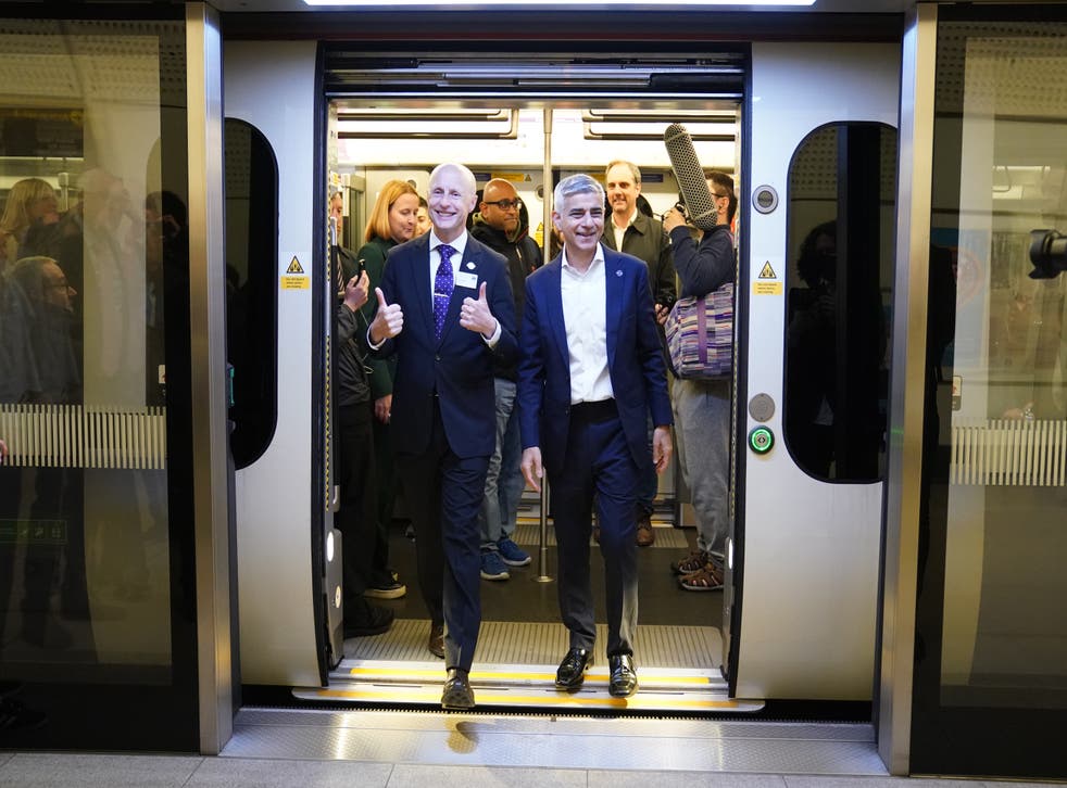 Mayor of London Saiq Khan (right) and Andy Byford, Commissioner at Transport for London (Tfl) disembark the first Elizabeth line train (Kirsty O’Connor/PA)