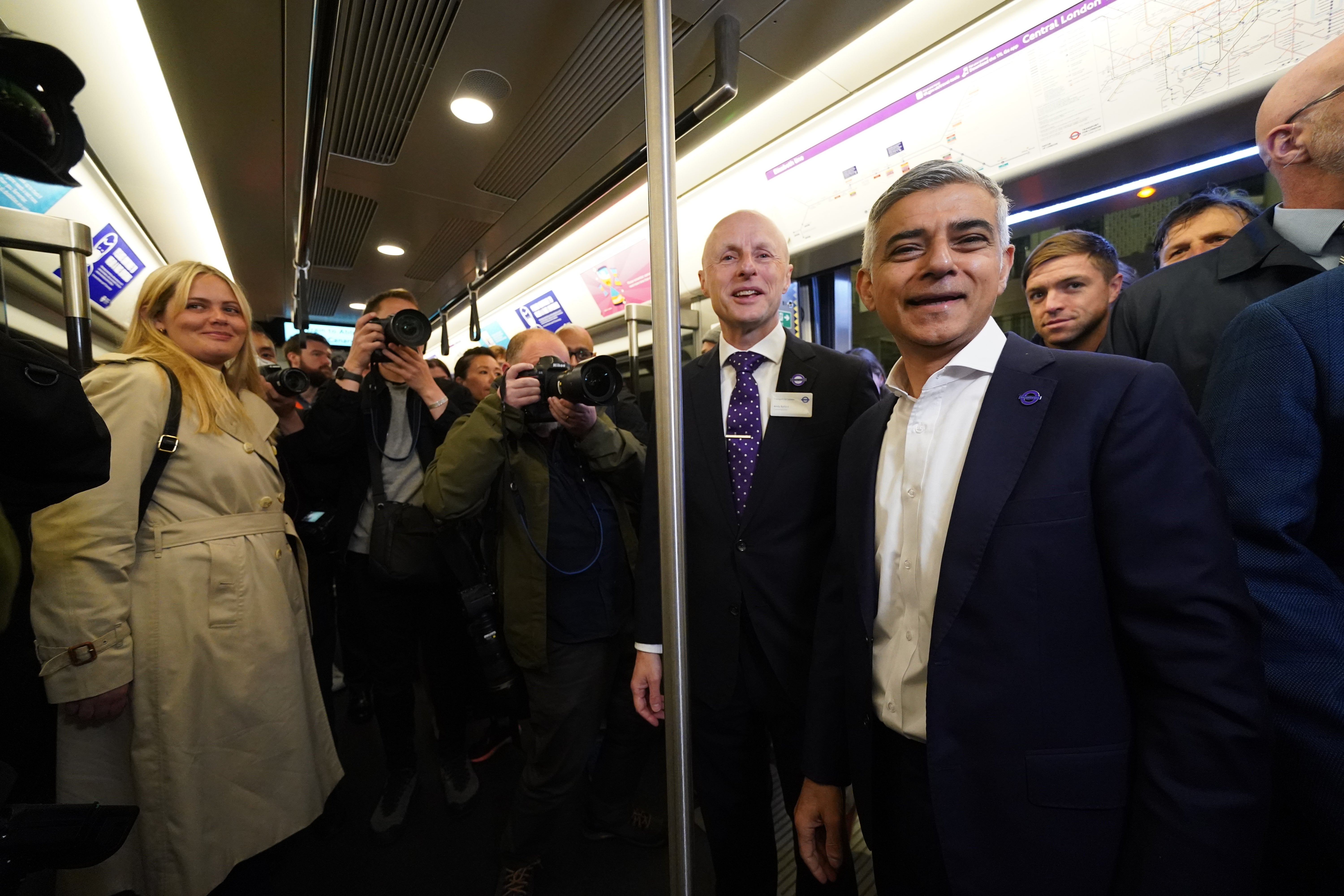Mayor of London Sadiq Khan and Andy Byford, Commissioner at Transport for London, travel on the first Elizabeth line train to carry passengers at Paddington Station (Kirsty O’Connor/PA)