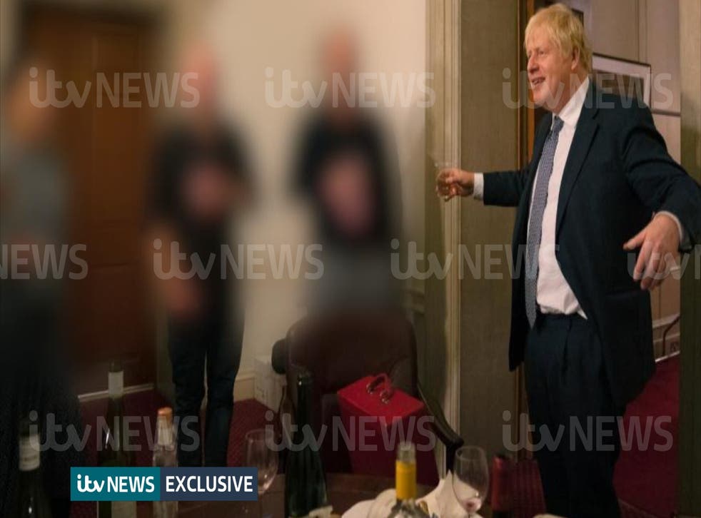 A photograph obtained by ITV News of the Prime Minister raising a glass at a leaving party on November 13 2020 (ITV/PA)