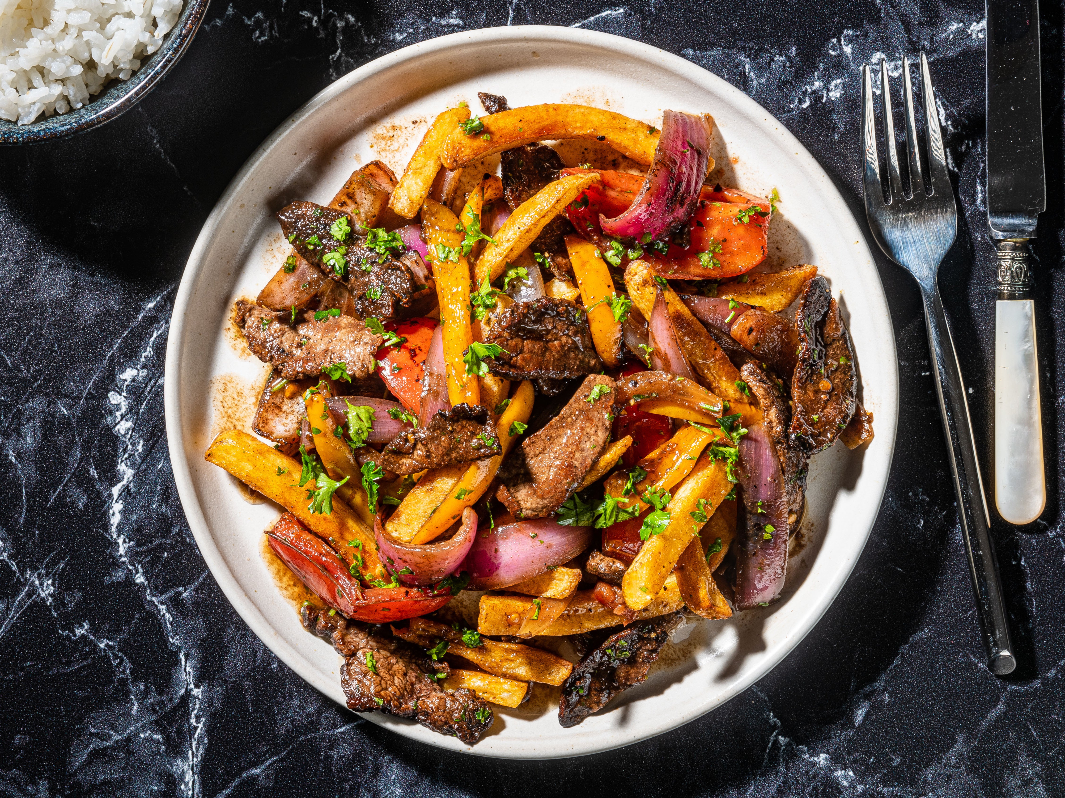 Classic lomo saltado is a literal translation of its Spanish name: a beef stir-fry
