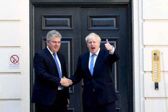 Boris Johnson (right) with Conservative party chairman Brandon Lewis (PA)