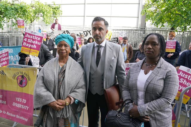 Sheku’s mother Aminata Bayoh (left) and sister Kadi Johnson with lawyer Aamer Anwar outside Capital House in Edinburgh (Andrew Milligan/PA)