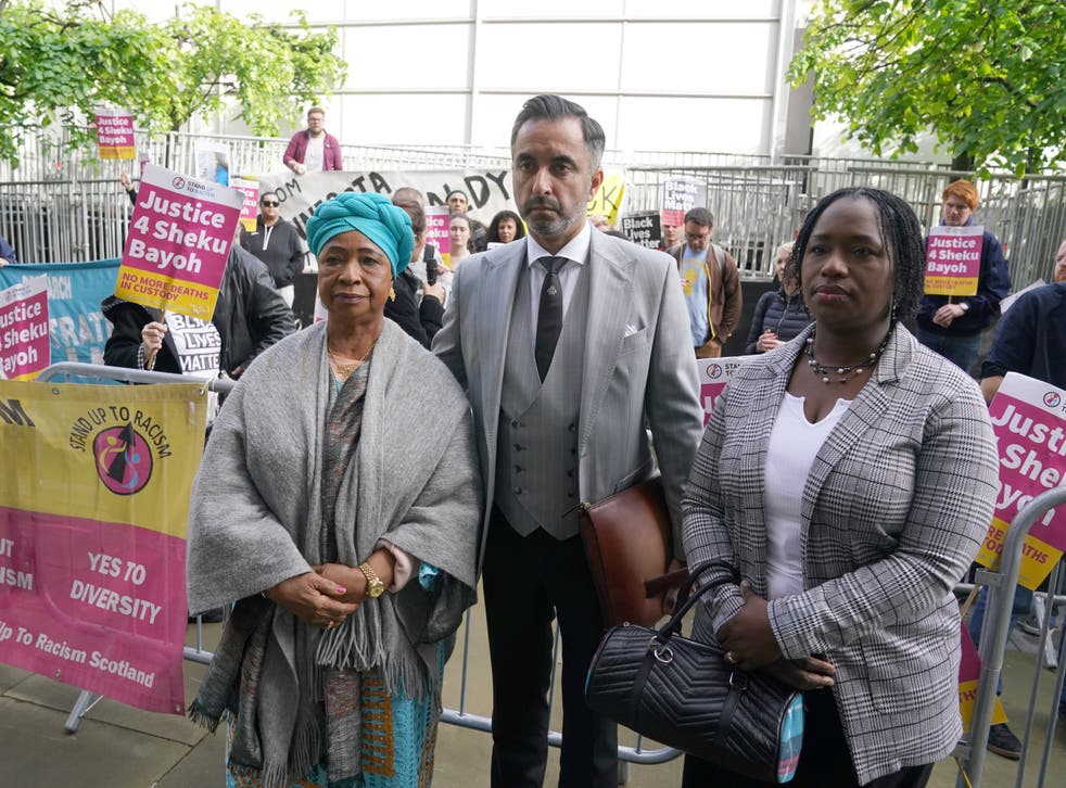 Sheku’s mother Aminata Bayoh (left) and sister Kadi Johnson with lawyer Aamer Anwar outside Capital House in Edinburgh (Andrew Milligan/PA)
