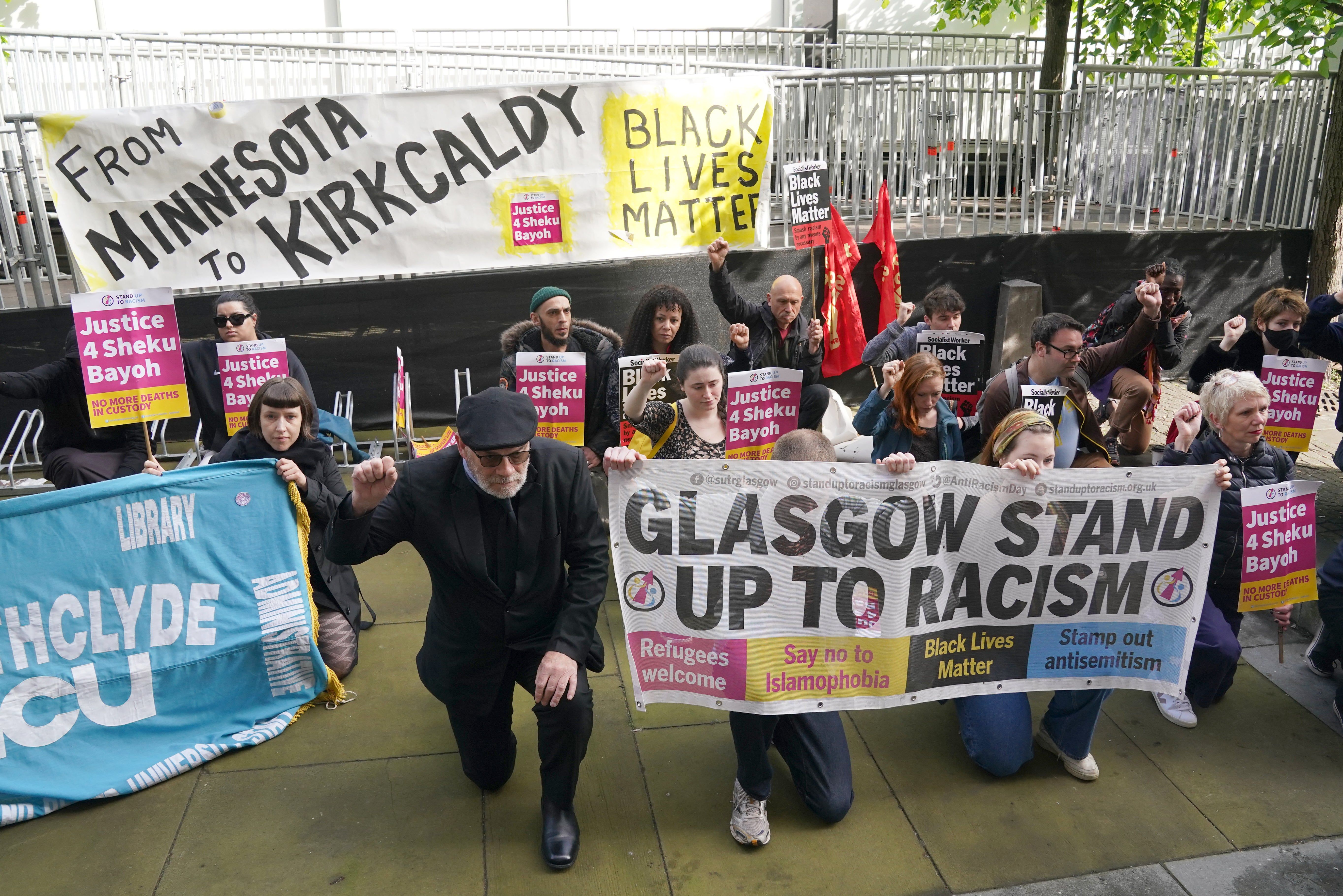 Protesters and supporters of the Bayoh family took the knee outside the inquiry venue (Andrew Milligan/PA)