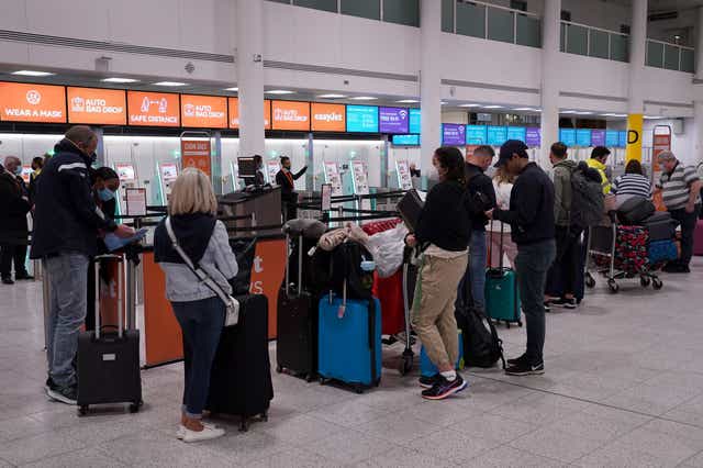 Gatwick airport is dealing with long queues every day (Gareth Fuller/PA)