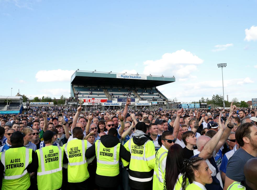 Fans invaded the pitch at Bristol Rovers’ final League Two match of the season against Scunthorpe (Bradley Collyer/PA)
